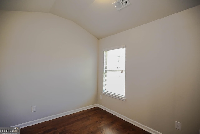 2304 Shetley Creek Dr, Norcross, GA 30071 - spare room with vaulted ceiling, plenty of natural light, baseboards, and dark wood finished floors