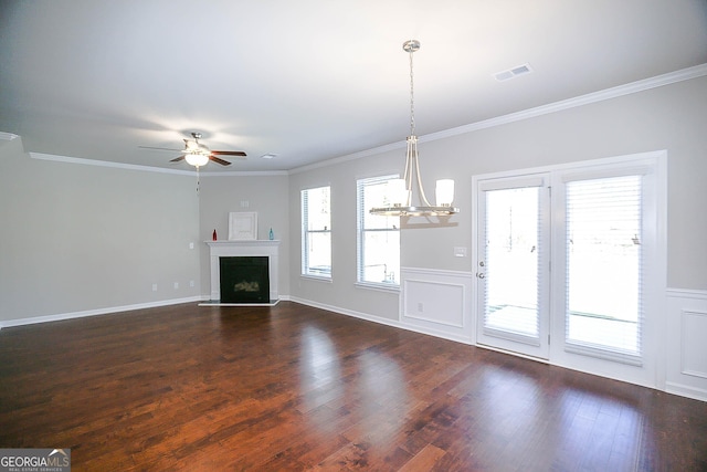 2304 Shetley Creek Dr, Norcross, GA 30071 - unfurnished living room featuring dark wood-style flooring, a chandelier, ceiling fan, a fireplace with raised hearth, and ornamental molding