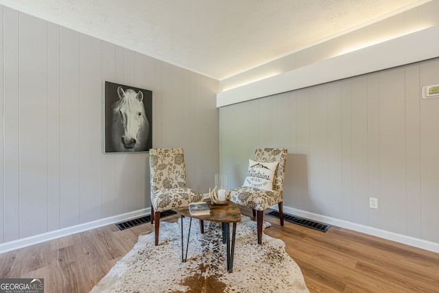 130 April Trce, Dawsonville, GA 30534 - sitting room featuring wood finished floors, baseboards, and ornamental molding