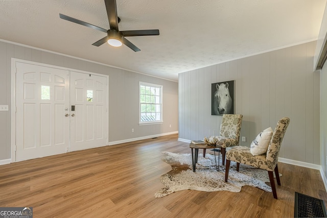 130 April Trce, Dawsonville, GA 30534 - entryway featuring ornamental molding, a ceiling fan, wood finished floors, baseboards, and a textured ceiling