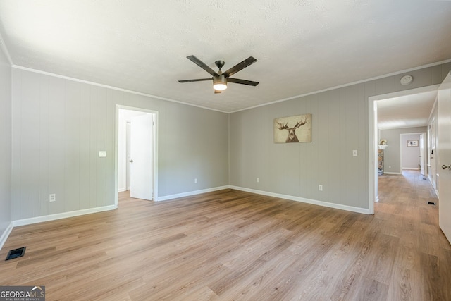 130 April Trce, Dawsonville, GA 30534 - spare room featuring ceiling fan, light wood-style flooring, crown molding, and baseboards