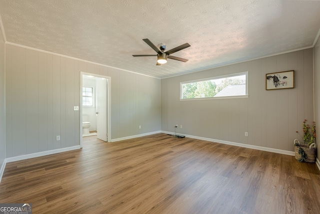 130 April Trce, Dawsonville, GA 30534 - spare room with healthy amount of natural light, wood finished floors, ceiling fan, a textured ceiling, and baseboards