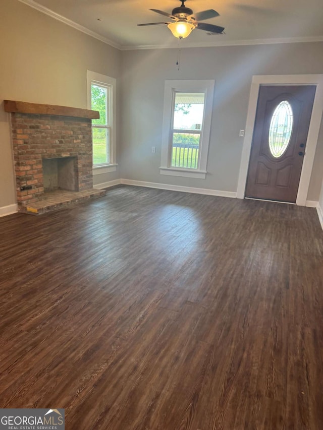 3 Thurman Dasher Rd, Reidsville, GA 30453 - unfurnished living room with dark wood-style floors, healthy amount of natural light, baseboards, a ceiling fan, and ornamental molding