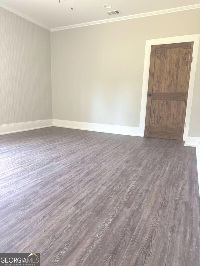 3 Thurman Dasher Rd, Reidsville, GA 30453 - unfurnished room with dark wood-style flooring, crown molding, and baseboards
