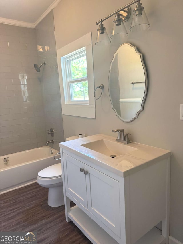 3 Thurman Dasher Rd, Reidsville, GA 30453 - full bathroom featuring vanity, toilet, ornamental molding, tub / shower combination, and wood finished floors