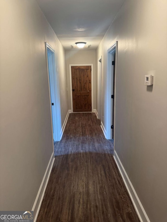 3 Thurman Dasher Rd, Reidsville, GA 30453 - corridor featuring dark wood-style floors and baseboards