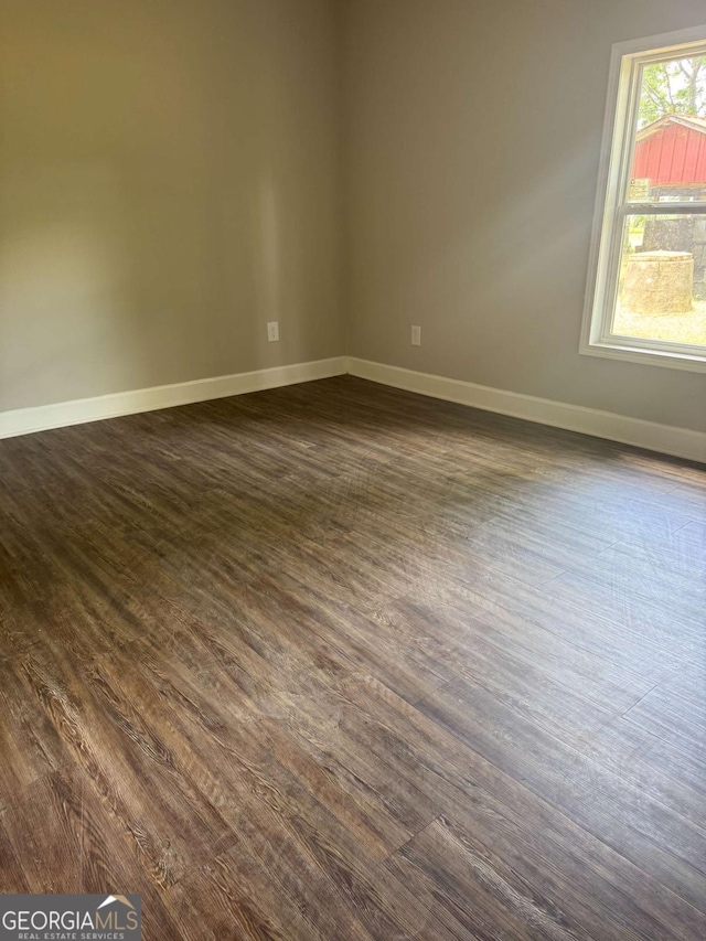 3 Thurman Dasher Rd, Reidsville, GA 30453 - spare room featuring dark wood-type flooring and baseboards