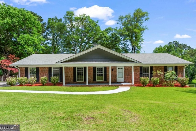 8415 Ridge Rd, Fairburn, GA 30213 - ranch-style house featuring a porch, a front yard, and brick siding