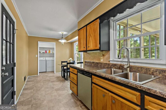 8415 Ridge Rd, Fairburn, GA 30213 - kitchen with stainless steel dishwasher, a sink, independent washer and dryer, dark countertops, and brown cabinetry