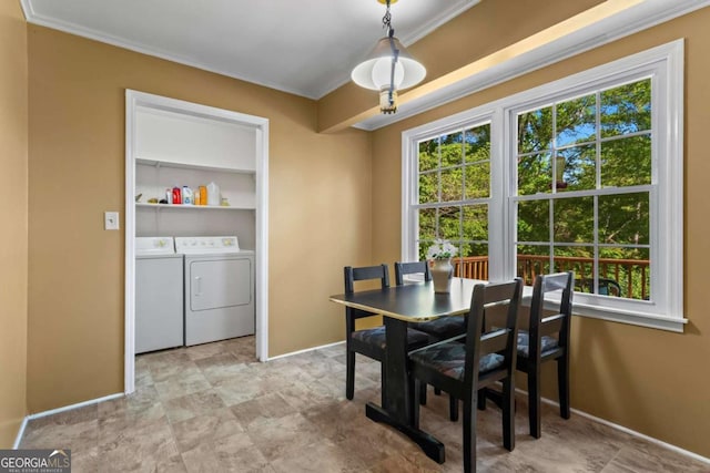 8415 Ridge Rd, Fairburn, GA 30213 - dining room featuring washer and clothes dryer, plenty of natural light, crown molding, and baseboards