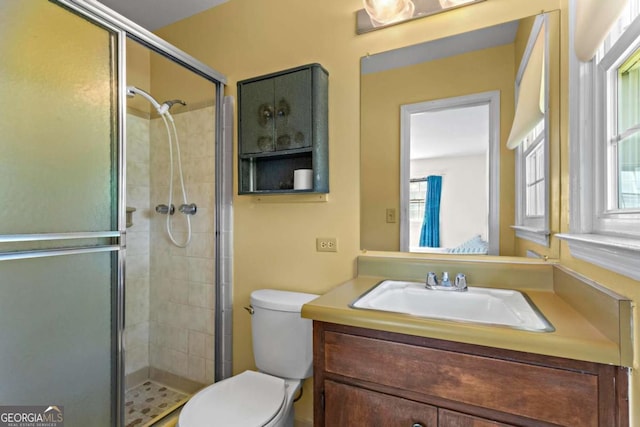 8415 Ridge Rd, Fairburn, GA 30213 - bathroom with toilet, a stall shower, and vanity