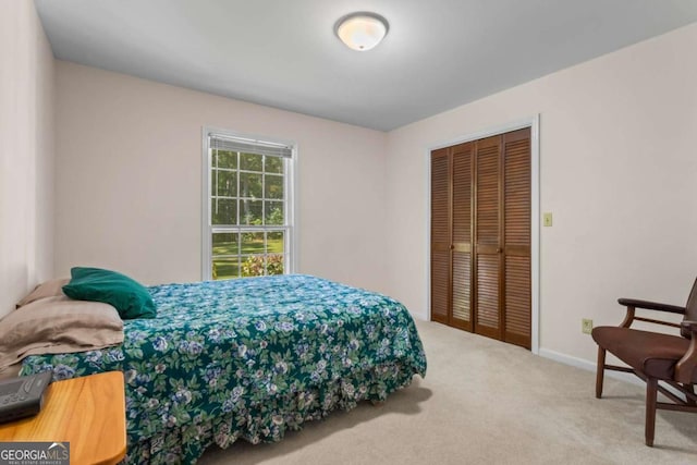 8415 Ridge Rd, Fairburn, GA 30213 - bedroom with a closet, carpet flooring, and baseboards
