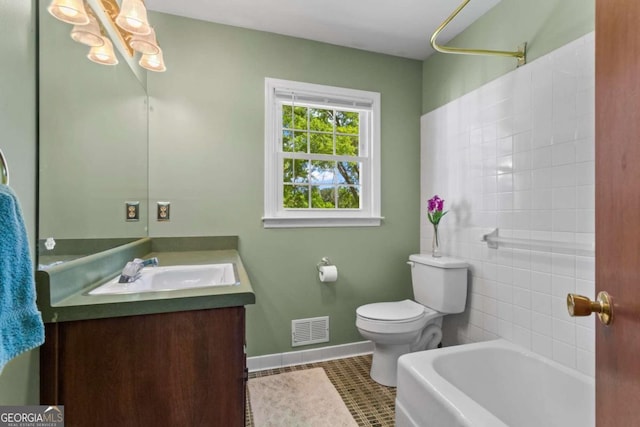 8415 Ridge Rd, Fairburn, GA 30213 - full bathroom with vanity, toilet, baseboards, and tile patterned floors