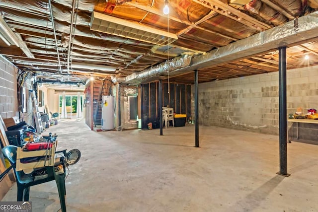 8415 Ridge Rd, Fairburn, GA 30213 - below grade area featuring gas water heater and concrete block wall