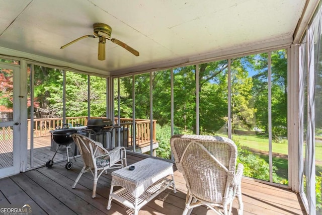 8415 Ridge Rd, Fairburn, GA 30213 - sunroom / solarium with a ceiling fan, plenty of natural light, and view of scattered trees