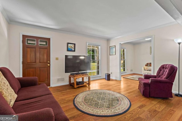 8415 Ridge Rd, Fairburn, GA 30213 - living room with wood finished floors, ornamental molding, and baseboards
