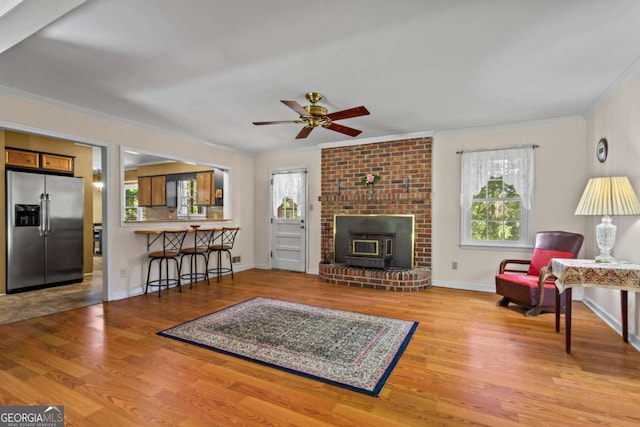 8415 Ridge Rd, Fairburn, GA 30213 - living room with crown molding, wood finished floors, ceiling fan, and baseboards