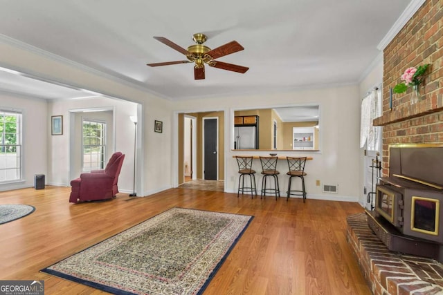 8415 Ridge Rd, Fairburn, GA 30213 - living room featuring ornamental molding, wood finished floors, ceiling fan, and baseboards