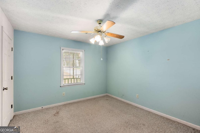 2617 Laurel Woods Ln SE, Conyers, GA 30094 - unfurnished room featuring a ceiling fan, carpet floors, a textured ceiling, and baseboards