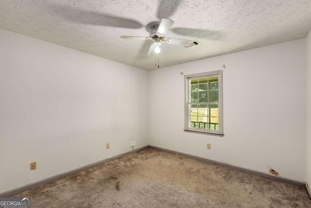 2617 Laurel Woods Ln SE, Conyers, GA 30094 - empty room featuring carpet, ceiling fan, baseboards, and a textured ceiling