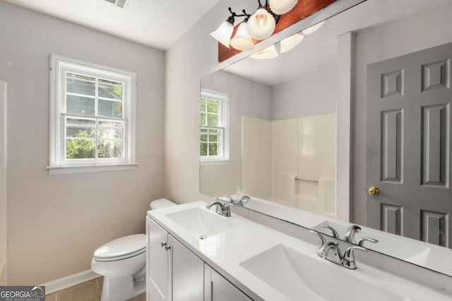 2617 Laurel Woods Ln SE, Conyers, GA 30094 - full bathroom featuring toilet, double vanity, baseboards, a shower, and tile patterned flooring