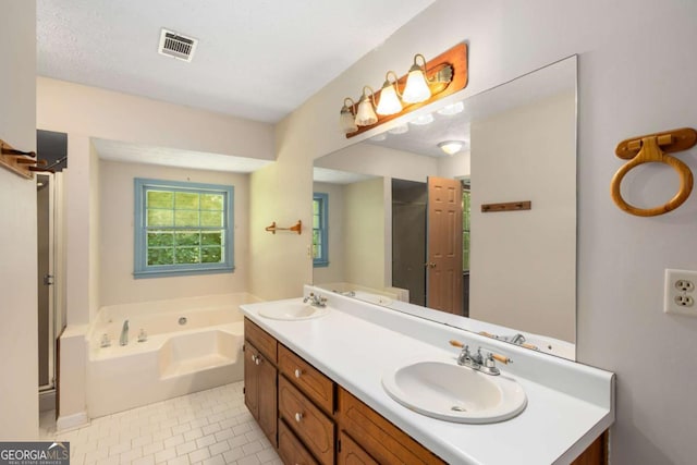 2617 Laurel Woods Ln SE, Conyers, GA 30094 - full bathroom with double vanity, a garden tub, tile patterned flooring, and a shower