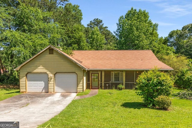 2617 Laurel Woods Ln SE, Conyers, GA 30094 - view of front of house with driveway, an attached garage, a front lawn, and a porch