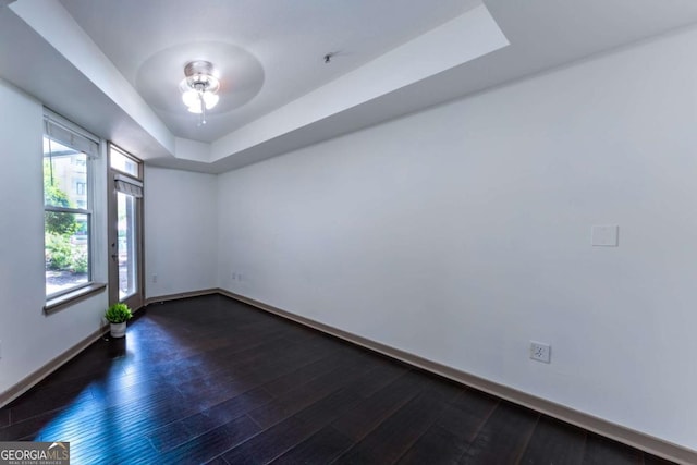390 17th St NW Unit 2040, Atlanta, GA 30363 - empty room with a ceiling fan, dark wood-style flooring, and a raised ceiling