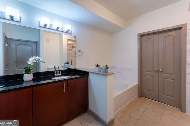 390 17th St NW Unit 2040, Atlanta, GA 30363 - bathroom with double vanity, a bath, and tile patterned floors