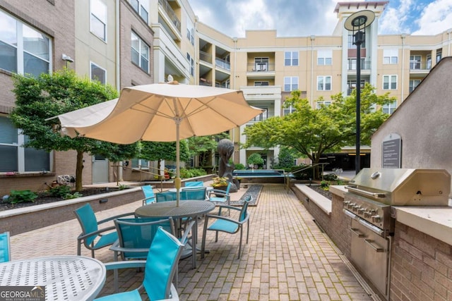 390 17th St NW Unit 2040, Atlanta, GA 30363 - view of patio / terrace featuring area for grilling and outdoor dining space