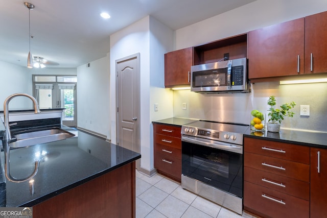 390 17th St NW Unit 2040, Atlanta, GA 30363 - kitchen with stainless steel appliances, light tile patterned flooring, ceiling fan, recessed lighting, and dark stone countertops
