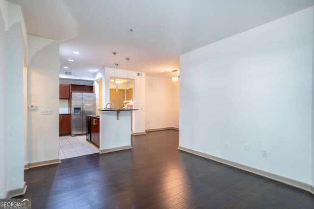 390 17th St NW Unit 2040, Atlanta, GA 30363 - unfurnished living room featuring wood finished floors and recessed lighting