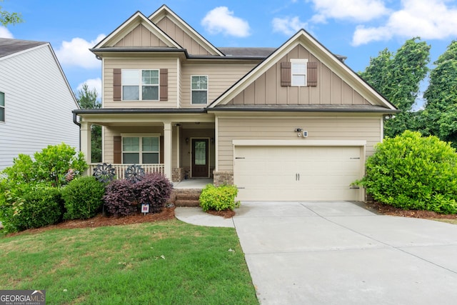 1537 Maplecliff Way, Sugar Hill, GA 30518 - craftsman inspired home featuring board and batten siding, covered porch, concrete driveway, a front yard, and a garage