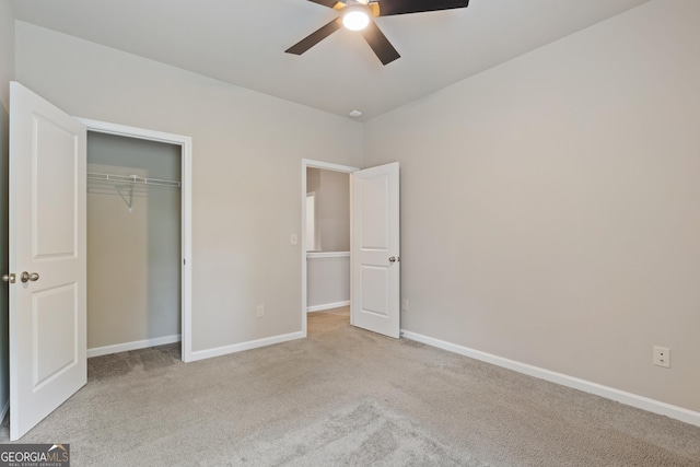 1537 Maplecliff Way, Sugar Hill, GA 30518 - unfurnished bedroom with carpet flooring, a closet, baseboards, and a ceiling fan