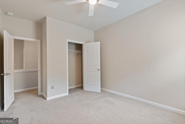 1537 Maplecliff Way, Sugar Hill, GA 30518 - unfurnished bedroom featuring carpet flooring, baseboards, a closet, and a ceiling fan