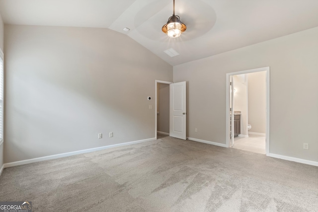 1537 Maplecliff Way, Sugar Hill, GA 30518 - unfurnished bedroom with vaulted ceiling, carpet flooring, ensuite bathroom, and baseboards