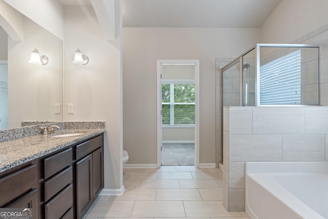1537 Maplecliff Way, Sugar Hill, GA 30518 - bathroom with vanity, a garden tub, a shower stall, toilet, and tile patterned flooring
