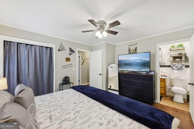5222 Skyline Dr, Stone Mountain, GA 30083 - bedroom with wood finished floors, ornamental molding, ceiling fan, and connected bathroom