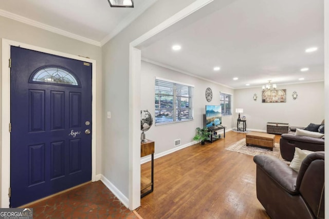 5222 Skyline Dr, Stone Mountain, GA 30083 - foyer with crown molding, a chandelier, recessed lighting, baseboards, and wood finished floors