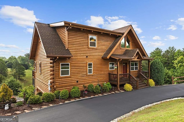 325 Emelia Dr, Morganton, GA 30560 - log-style house with a shingled roof and log siding