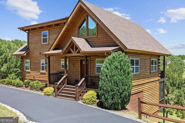 325 Emelia Dr, Morganton, GA 30560 - log-style house with a porch, faux log siding, and a shingled roof