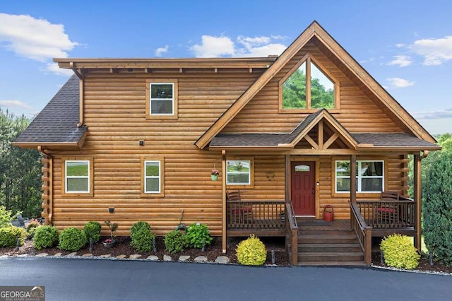 325 Emelia Dr, Morganton, GA 30560 - log-style house featuring log siding, roof with shingles, and covered porch