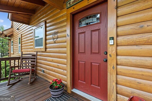 325 Emelia Dr, Morganton, GA 30560 - property entrance with covered porch and faux log siding