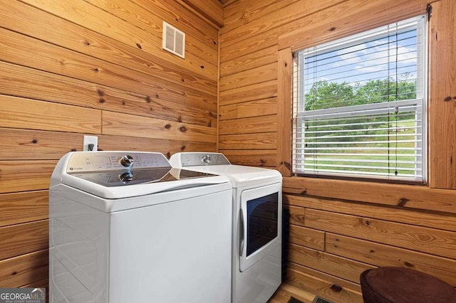 325 Emelia Dr, Morganton, GA 30560 - laundry room with washer and dryer, plenty of natural light, and wood walls