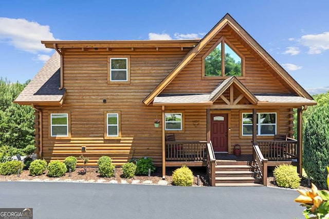 325 Emelia Dr, Morganton, GA 30560 - log cabin featuring log siding, a porch, and a shingled roof