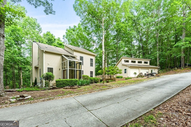 425 Wagers Mill Rd, Newnan, GA 30263 - view of front of home with a garage and a sunroom