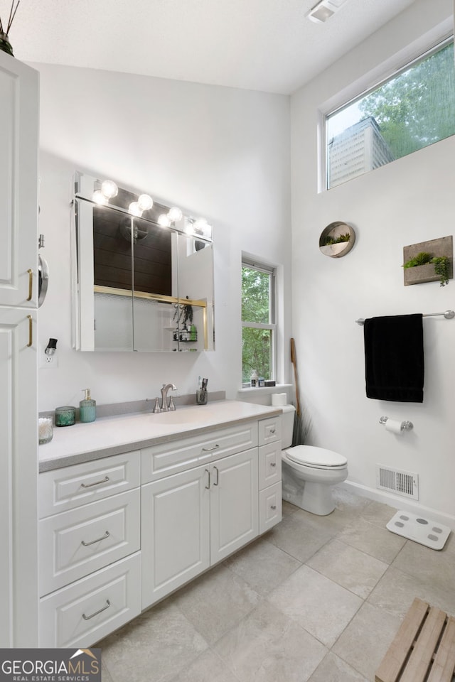 425 Wagers Mill Rd, Newnan, GA 30263 - full bath with a high ceiling, vanity, toilet, and tile patterned floors