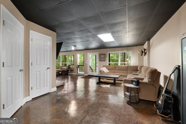 425 Wagers Mill Rd, Newnan, GA 30263 - living room with a drop ceiling, concrete flooring, and baseboards