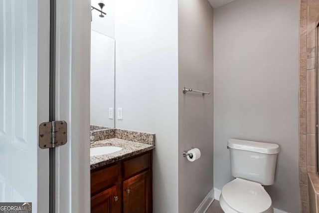7 Villa Ct SE, Smyrna, GA 30080 - bathroom featuring toilet, vanity, and baseboards