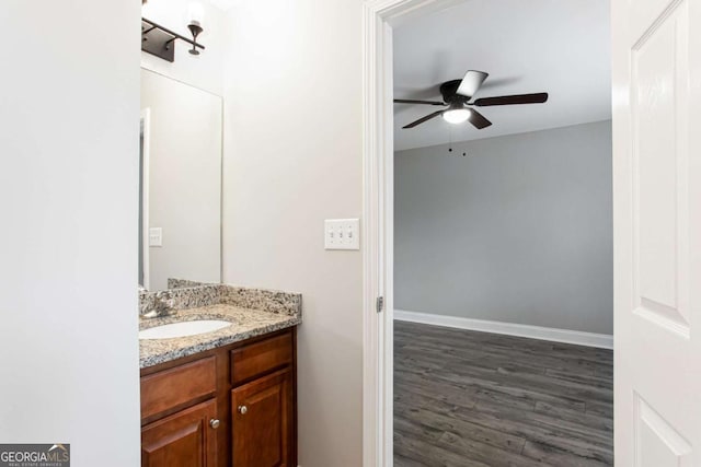 7 Villa Ct SE, Smyrna, GA 30080 - bathroom featuring vanity, ceiling fan, wood finished floors, and baseboards